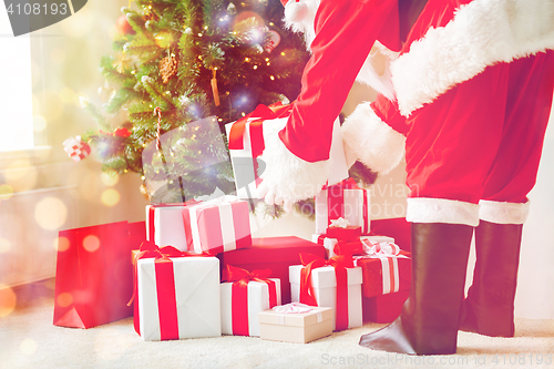 Image of close up of santa claus with presents