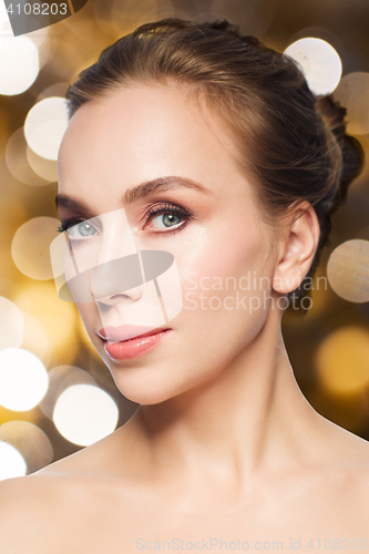 Image of beautiful young woman face over white background