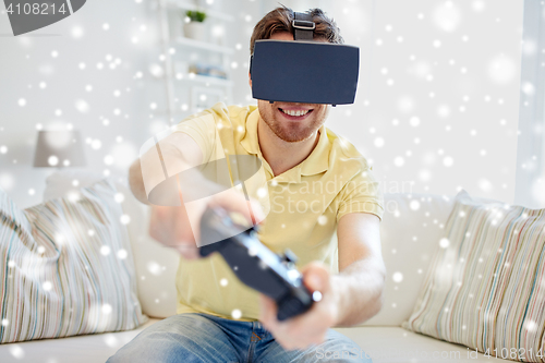 Image of man in virtual reality headset with controller