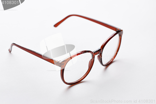 Image of Brown-rim glasses with transparent lenses