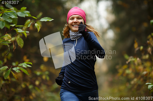 Image of Cheerful blonde runs in morning