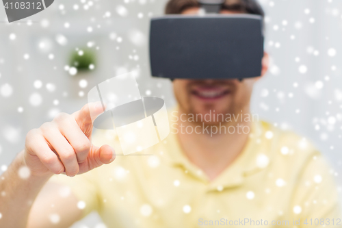 Image of young man in virtual reality headset or 3d glasses