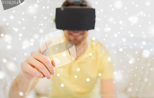 Image of young man in virtual reality headset or 3d glasses