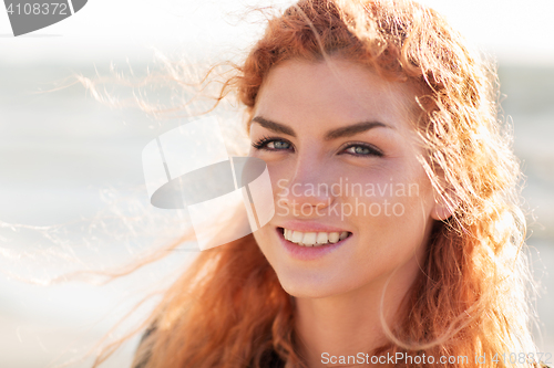 Image of close up of happy young redhead woman face