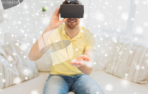 Image of young man in virtual reality headset or 3d glasses