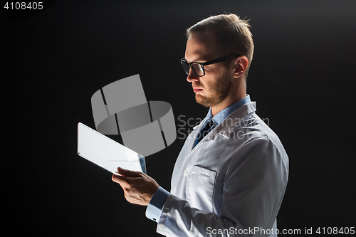 Image of close up of doctor or scientist with tablet pc