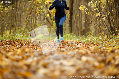 Image of Girl in sportswear running autumn