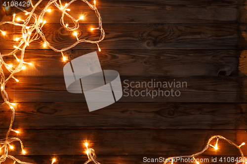 Image of Garland on brown wooden background