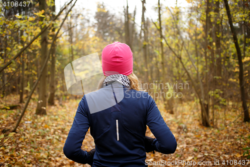 Image of Blonde girl jogging in morning