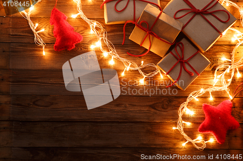 Image of Christmas presents on wooden background