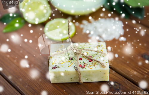 Image of handmade herbal soap bar on wood