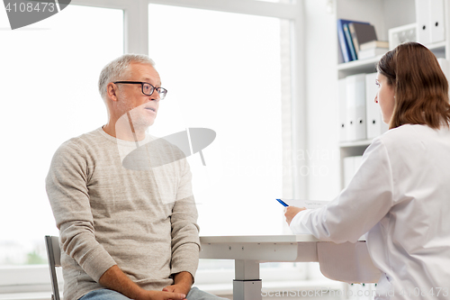 Image of senior man and doctor meeting at hospital