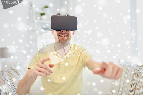 Image of young man in virtual reality headset or 3d glasses