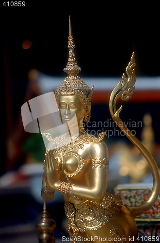 Image of Gold praying statue