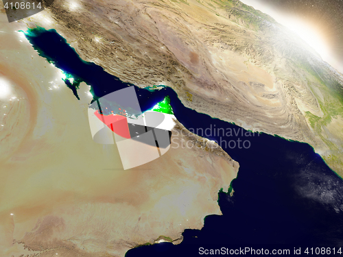 Image of United Arab Emirates with flag in rising sun