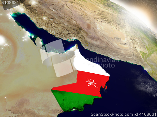 Image of Oman with flag in rising sun