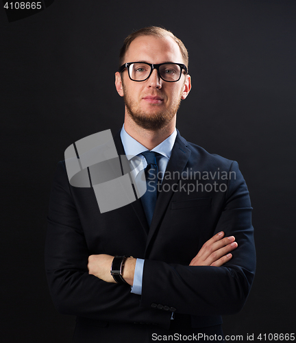 Image of businessman in suit and eyeglasses