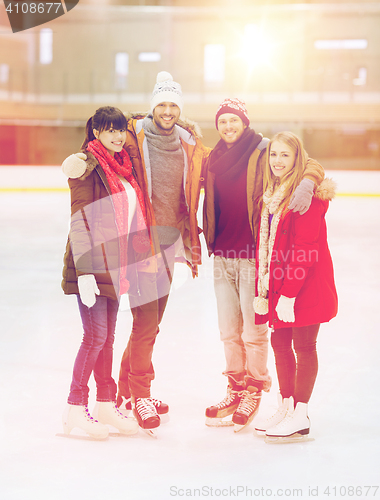 Image of happy friends on skating rink