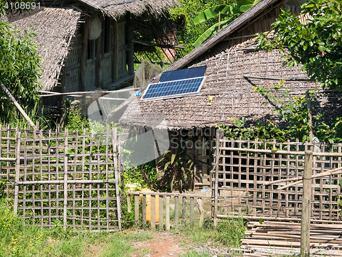 Image of Straw house with solar panel