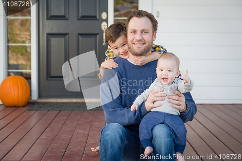 Image of Mixed Race Father and Sons on Front Porch