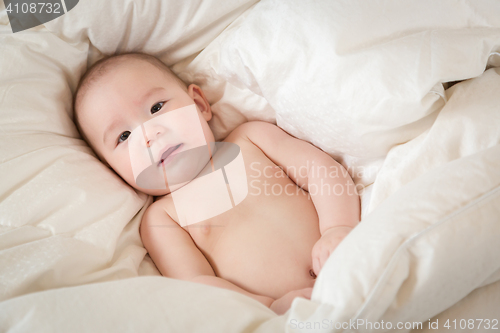 Image of Mixed Race Baby Boy Having Fun on His Blanket