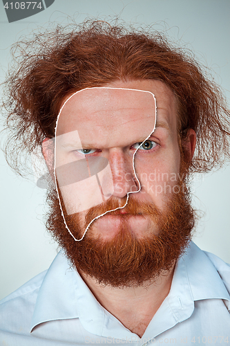 Image of Portrait of young man with shocked facial expression