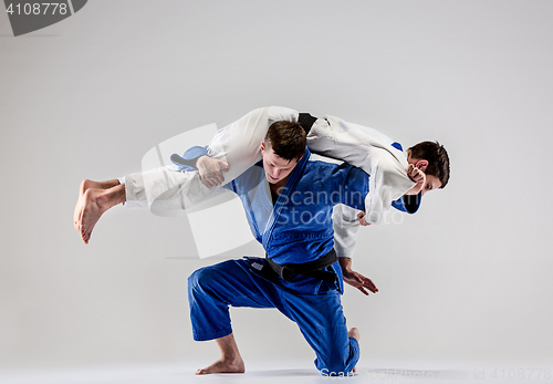 Image of The two judokas fighters fighting men