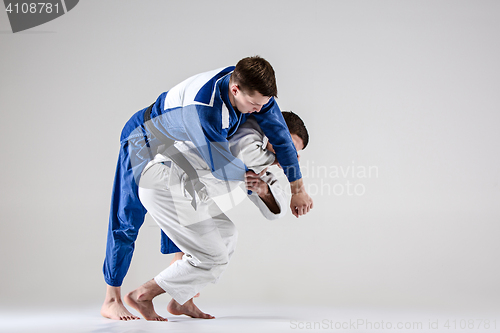 Image of The two judokas fighters fighting men