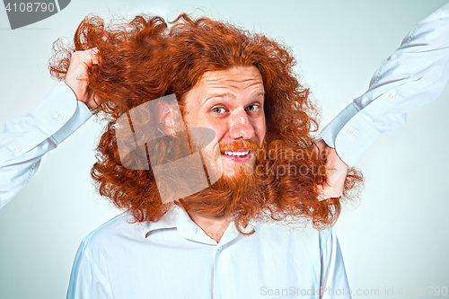 Image of The Angry man tearing his hair