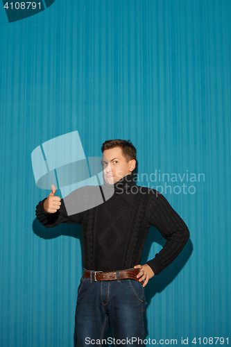 Image of Portrait of young man with serious facial expression