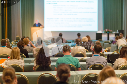 Image of Audience in lecture hall participating at business conference.