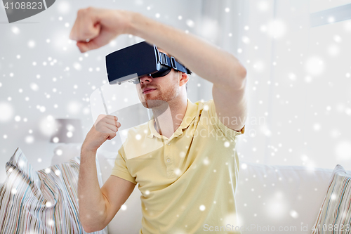 Image of young man in virtual reality headset or 3d glasses