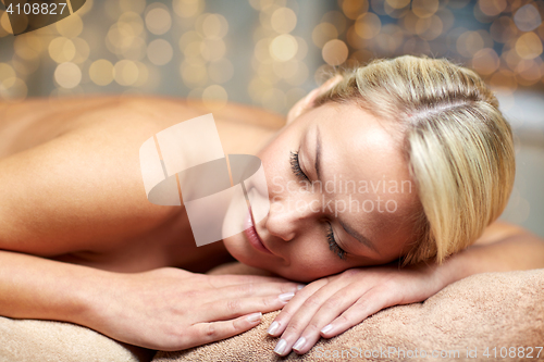 Image of close up of woman lying on massage table in spa