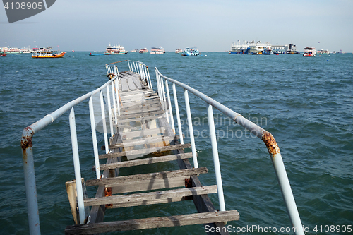 Image of The wooden bridge extending into the sea