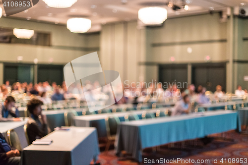 Image of Blured image of audience in conference hall attending business conference.