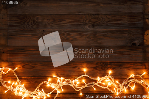 Image of Christmas garland on brown background