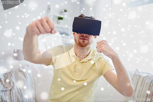 Image of young man in virtual reality headset or 3d glasses