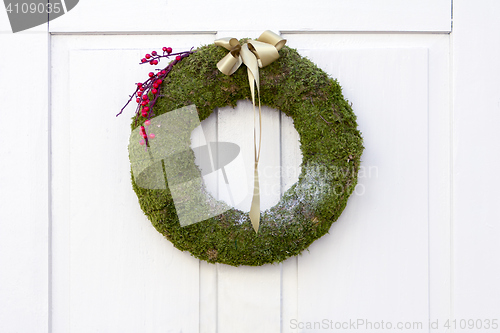 Image of Advent Christmas wreath on white door decoration
