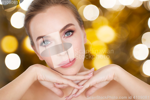 Image of beautiful young woman face and hands