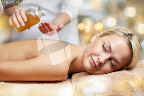 Image of close up of woman lying on massage table in spa