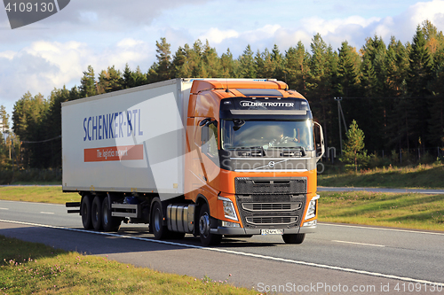 Image of Orange Volvo FH 420 Semi Trailer on Motorway