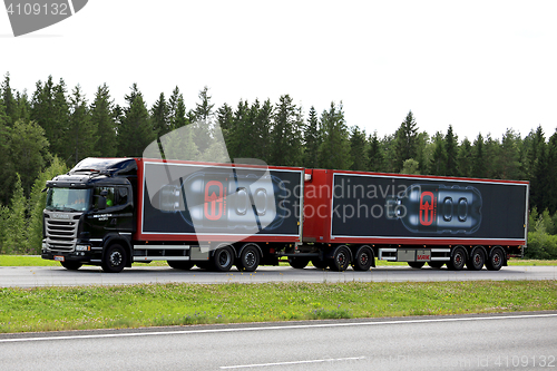 Image of Black Scania R450 Energy Drink Transport on the Road