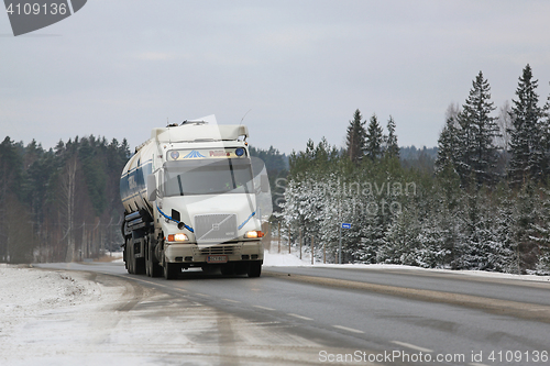 Image of White Volvo NH12 Semi Tank Truck on Winter Road