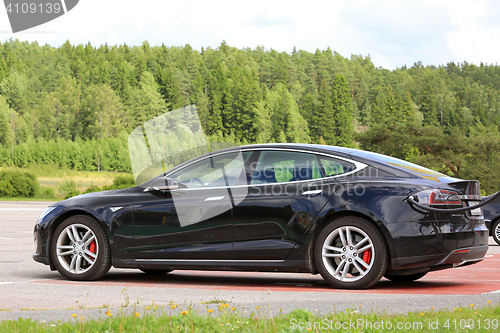 Image of Black Tesla Model S Electric Car Charging