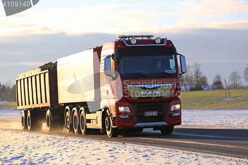 Image of Red MAN Sugar Beet Transport Truck on Early Winter Road