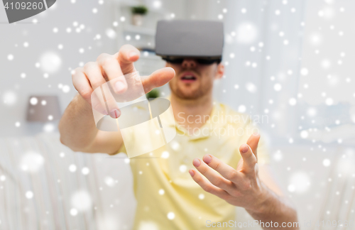 Image of young man in virtual reality headset or 3d glasses