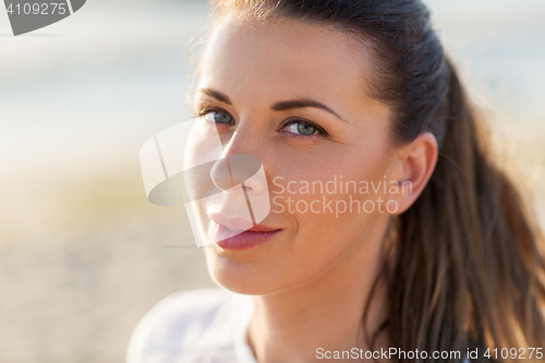 Image of close up of happy young woman face