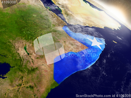 Image of Somalia with flag in rising sun