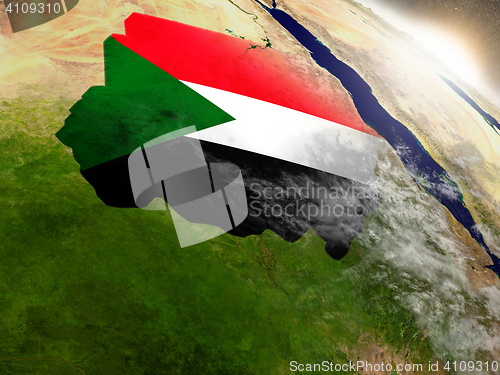 Image of Sudan with flag in rising sun