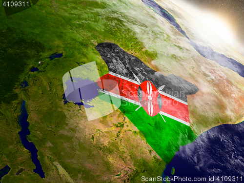 Image of Kenya with flag in rising sun